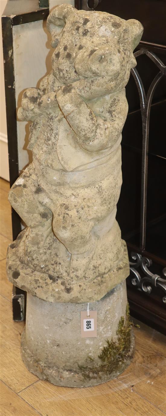 A reconstituted stone pig playing a flute H.80cm